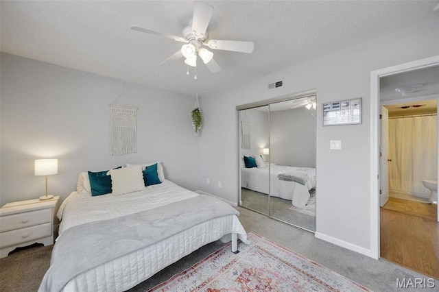 1419 Bluebird Ter, Saint Louis, MO 63144 - carpeted bedroom featuring a closet, a ceiling fan, baseboards, and a textured ceiling