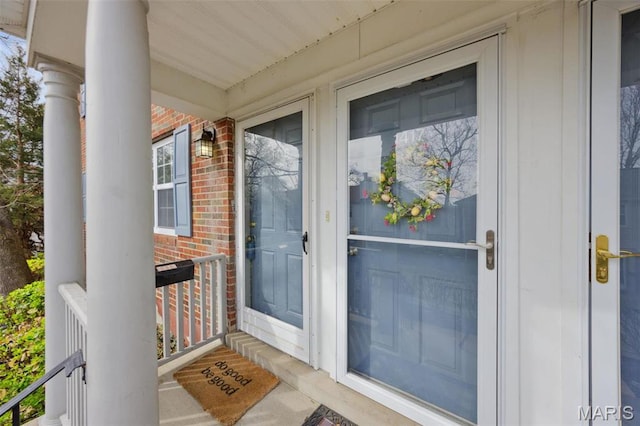 1419 Bluebird Ter, Saint Louis, MO 63144 - doorway to property featuring a porch and brick siding