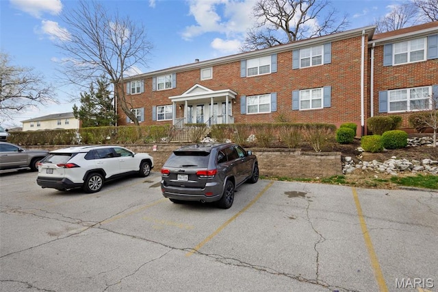 1419 Bluebird Ter, Saint Louis, MO 63144 - townhome / multi-family property with uncovered parking and brick siding