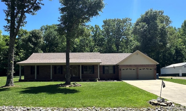 17264 Cedar Hills Dr, Dexter, MO 63841 - ranch-style home with driveway, an attached garage, brick siding, and a front lawn