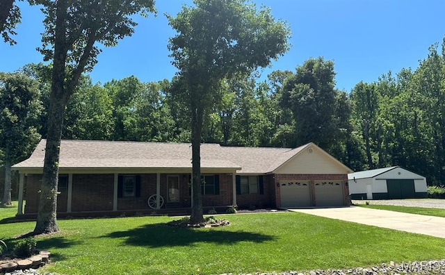 17264 Cedar Hills Dr, Dexter, MO 63841 - single story home with a garage, a front yard, concrete driveway, and brick siding
