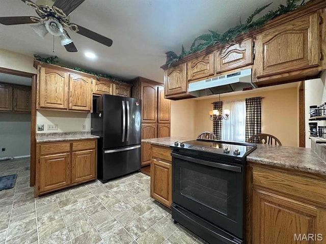 17264 Cedar Hills Dr, Dexter, MO 63841 - kitchen with black appliances, under cabinet range hood, a ceiling fan, brown cabinetry, and a chandelier