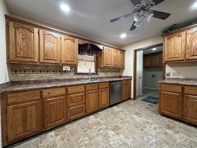 17264 Cedar Hills Dr, Dexter, MO 63841 - kitchen featuring stainless steel dishwasher, a sink, brown cabinetry, tasteful backsplash, and a ceiling fan