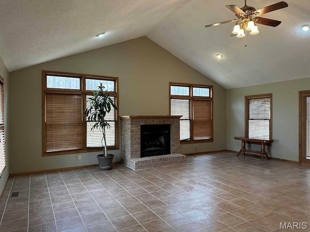 17264 Cedar Hills Dr, Dexter, MO 63841 - unfurnished living room with baseboards, a ceiling fan, a fireplace, healthy amount of natural light, and a textured ceiling