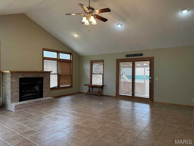 17264 Cedar Hills Dr, Dexter, MO 63841 - unfurnished living room featuring a ceiling fan, healthy amount of natural light, baseboards, tile patterned floors, and high vaulted ceiling
