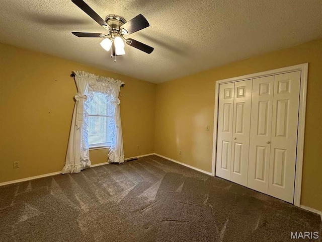 17264 Cedar Hills Dr, Dexter, MO 63841 - unfurnished bedroom with a textured ceiling, carpet flooring, baseboards, a closet, and a ceiling fan