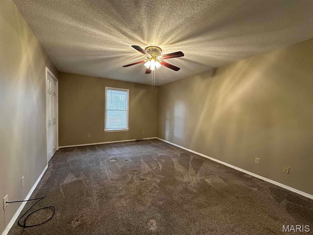 17264 Cedar Hills Dr, Dexter, MO 63841 - unfurnished room featuring dark carpet, ceiling fan, a textured ceiling, and baseboards