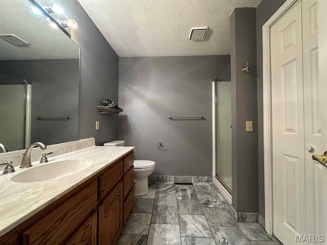 17264 Cedar Hills Dr, Dexter, MO 63841 - bathroom with vanity, a shower stall, toilet, baseboards, and a textured ceiling