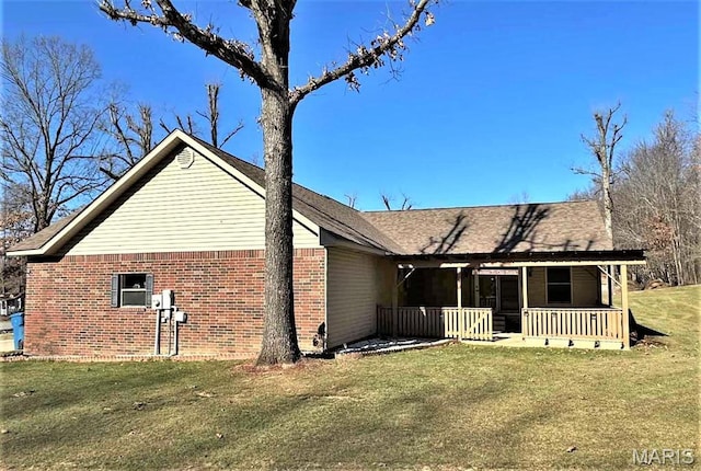 17264 Cedar Hills Dr, Dexter, MO 63841 - view of property exterior featuring brick siding, a porch, and a lawn