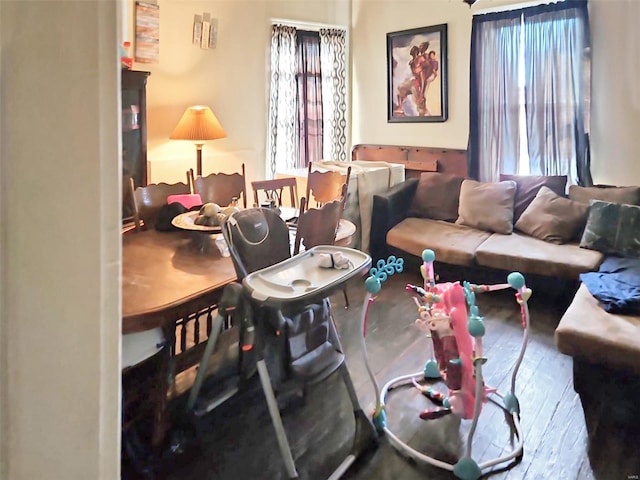 4918 Highland Ave, Saint Louis, MO 63113 - living area with plenty of natural light and wood finished floors