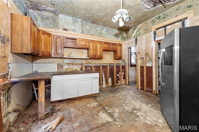 7307 Minnesota Ave, Saint Louis, MO 63111 - kitchen with freestanding refrigerator, open shelves, and brown cabinets