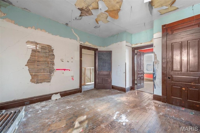7307 Minnesota Ave, Saint Louis, MO 63111 - unfurnished bedroom with hardwood / wood-style floors and baseboards