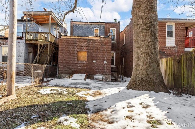 7307 Minnesota Ave, Saint Louis, MO 63111 - snow covered back of property featuring brick siding