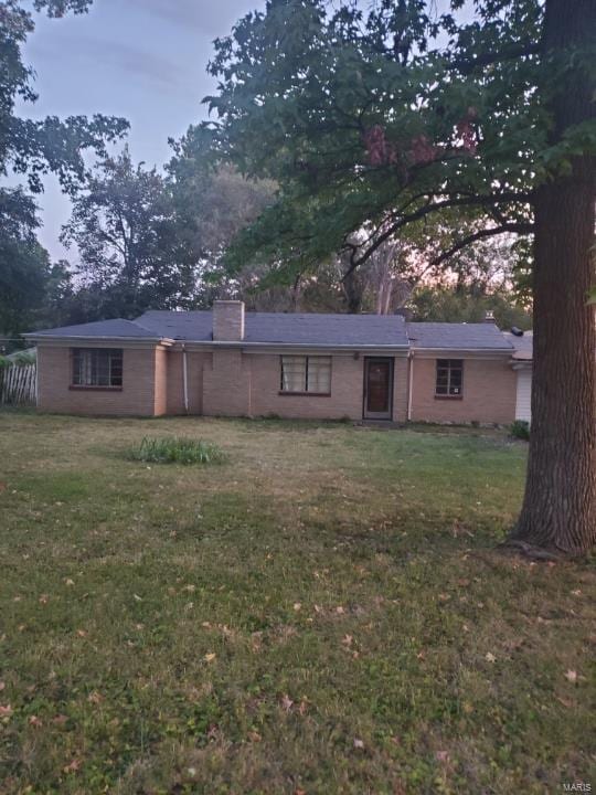 8140 Packard Ave, Berkeley, MO 63134 - ranch-style home with a front yard and a chimney