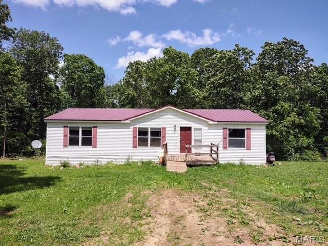 16625 Scott Ln, Willow Springs, MO 65793 - manufactured / mobile home with a front yard, a wooden deck, and metal roof