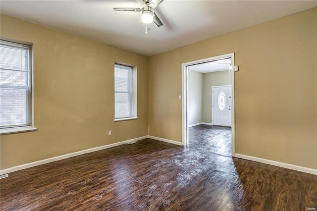 3018 Texas Ave, Saint Louis, MO 63118 - empty room with a ceiling fan, plenty of natural light, wood finished floors, and baseboards