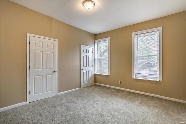 3018 Texas Ave, Saint Louis, MO 63118 - unfurnished bedroom with carpet flooring and baseboards