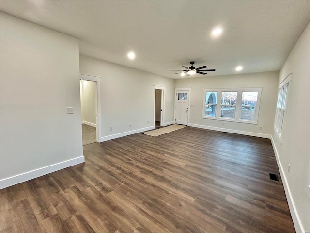 601 S Grand St, Salem, MO 65560 - unfurnished living room with ceiling fan, recessed lighting, dark wood-style flooring, and baseboards