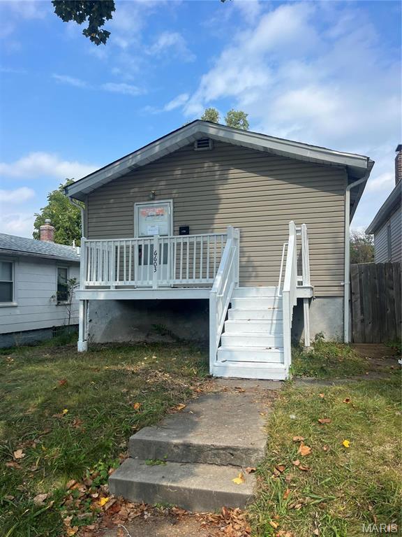 6603 Etzel Ave, University City, MO 63130 - rear view of house featuring a deck and fence
