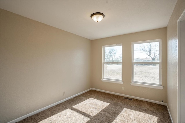 20 W Broadway, Ellsinore, MO 63937 - carpeted empty room featuring baseboards