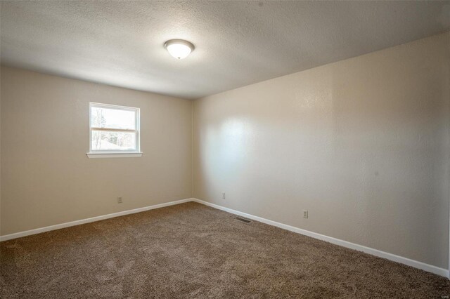 20 W Broadway, Ellsinore, MO 63937 - spare room with carpet floors, baseboards, and a textured ceiling