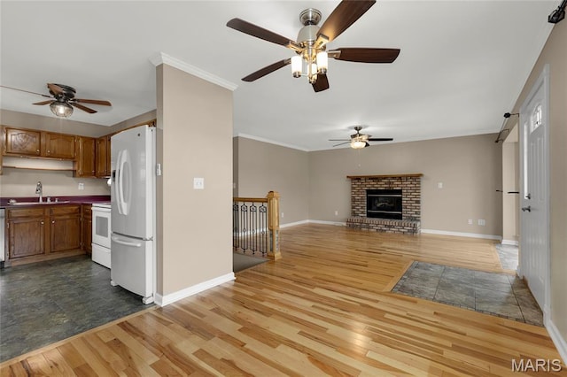4012 Sunny Brook Dr, Arnold, MO 63010 - kitchen featuring freestanding refrigerator, range, ceiling fan, wood finished floors, and crown molding
