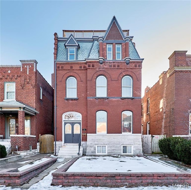 2922 S Compton Ave, Saint Louis, MO 63118 - view of front facade featuring brick siding and mansard roof