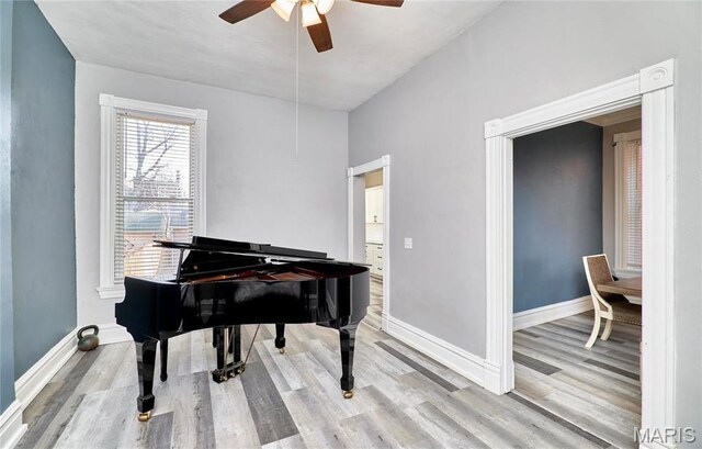 2922 S Compton Ave, Saint Louis, MO 63118 - living area with ceiling fan, wood finished floors, and baseboards