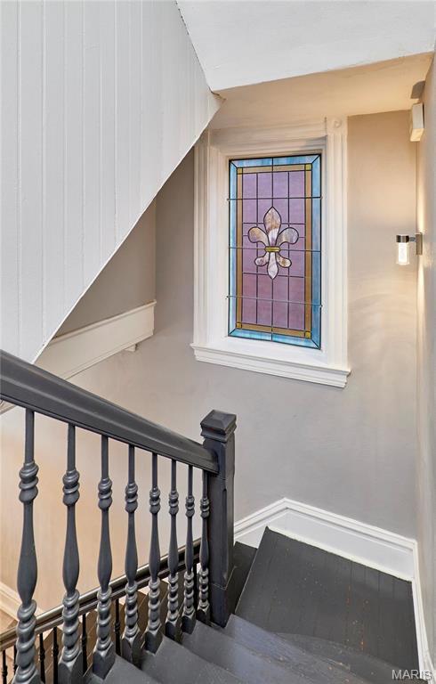 2922 S Compton Ave, Saint Louis, MO 63118 - staircase featuring baseboards