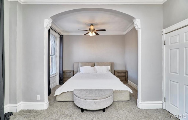2922 S Compton Ave, Saint Louis, MO 63118 - carpeted bedroom featuring arched walkways, crown molding, baseboards, and ceiling fan