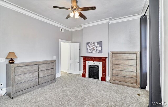 2922 S Compton Ave, Saint Louis, MO 63118 - living room with carpet flooring, crown molding, a ceiling fan, a fireplace, and baseboards