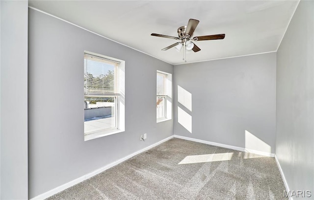 2922 S Compton Ave, Saint Louis, MO 63118 - carpeted empty room with baseboards and ceiling fan