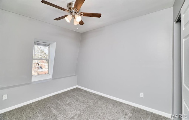 2922 S Compton Ave, Saint Louis, MO 63118 - empty room featuring ceiling fan, carpet floors, and baseboards