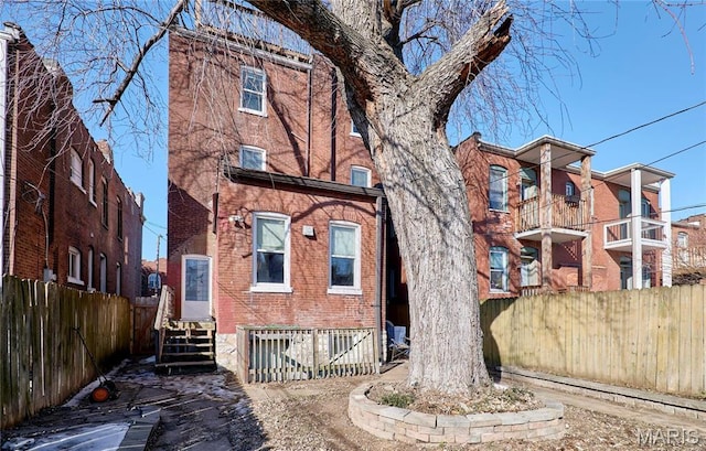 2922 S Compton Ave, Saint Louis, MO 63118 - view of front of house with fence and brick siding