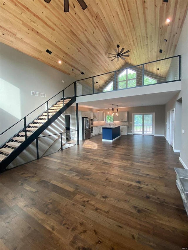 0 Nellies Rdg, Dow, IL 62022 - unfurnished living room with a ceiling fan, high vaulted ceiling, dark wood-type flooring, stairs, and wood ceiling