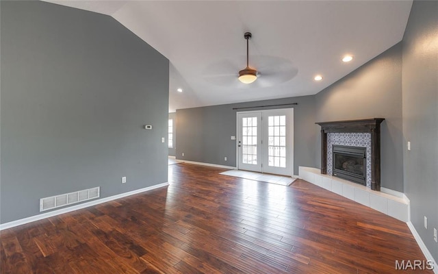 16855 Lemming Ln, Saint Robert, MO 65584 - unfurnished living room featuring ceiling fan, lofted ceiling, a fireplace, wood finished floors, and baseboards