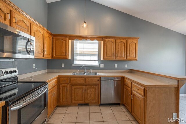 16855 Lemming Ln, Saint Robert, MO 65584 - kitchen with appliances with stainless steel finishes, a sink, a peninsula, brown cabinets, and light tile patterned floors