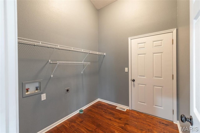 16855 Lemming Ln, Saint Robert, MO 65584 - laundry room with hookup for a washing machine, dark wood-type flooring, electric dryer hookup, and baseboards