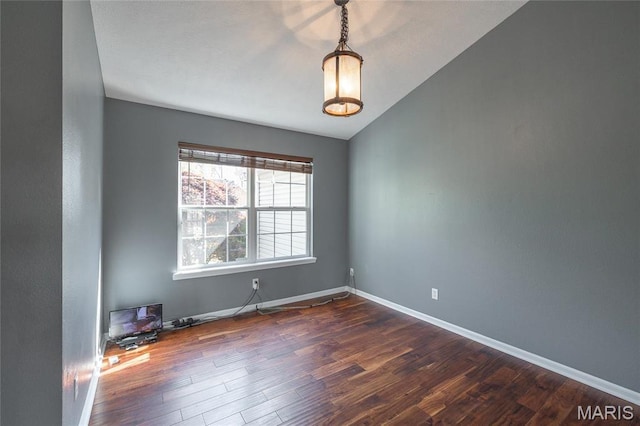 16855 Lemming Ln, Saint Robert, MO 65584 - unfurnished room featuring dark wood-type flooring, baseboards, and vaulted ceiling