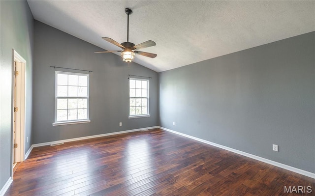 16855 Lemming Ln, Saint Robert, MO 65584 - empty room featuring vaulted ceiling, ceiling fan, wood finished floors, baseboards, and a textured ceiling