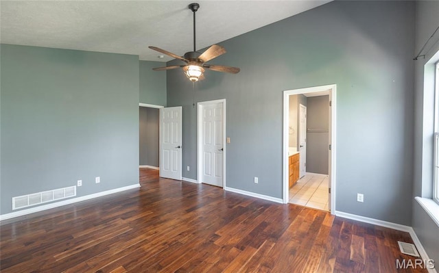 16855 Lemming Ln, Saint Robert, MO 65584 - unfurnished bedroom featuring high vaulted ceiling, baseboards, wood finished floors, and ceiling fan