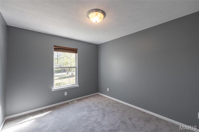 16855 Lemming Ln, Saint Robert, MO 65584 - carpeted spare room featuring baseboards and a textured ceiling