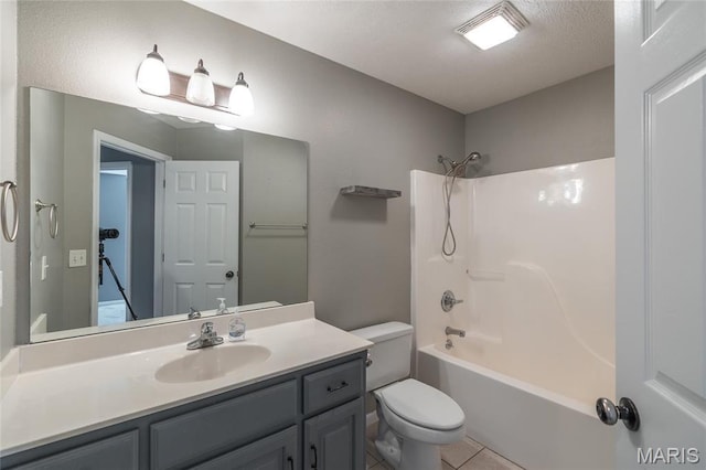 16855 Lemming Ln, Saint Robert, MO 65584 - bathroom featuring toilet, vanity, shower / tub combination, tile patterned floors, and a textured ceiling