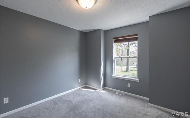 16855 Lemming Ln, Saint Robert, MO 65584 - carpeted empty room with a textured ceiling and baseboards