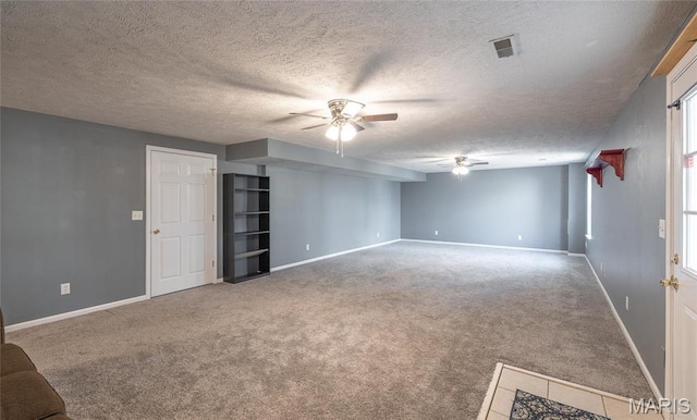 16855 Lemming Ln, Saint Robert, MO 65584 - unfurnished living room with a ceiling fan, carpet, a textured ceiling, and baseboards