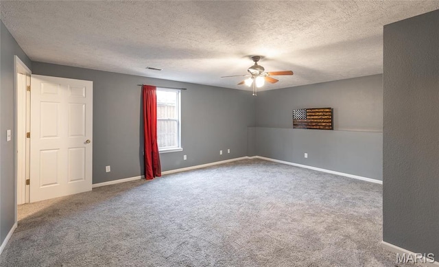 16855 Lemming Ln, Saint Robert, MO 65584 - carpeted spare room with a ceiling fan, a textured ceiling, and baseboards