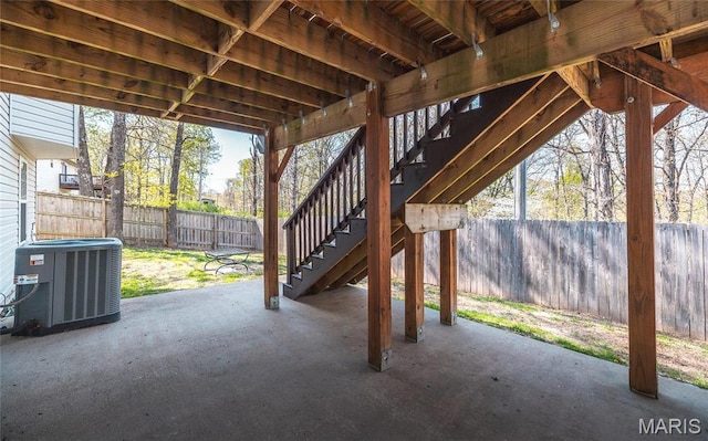16855 Lemming Ln, Saint Robert, MO 65584 - view of patio / terrace with central air condition unit, a fenced backyard, and stairs