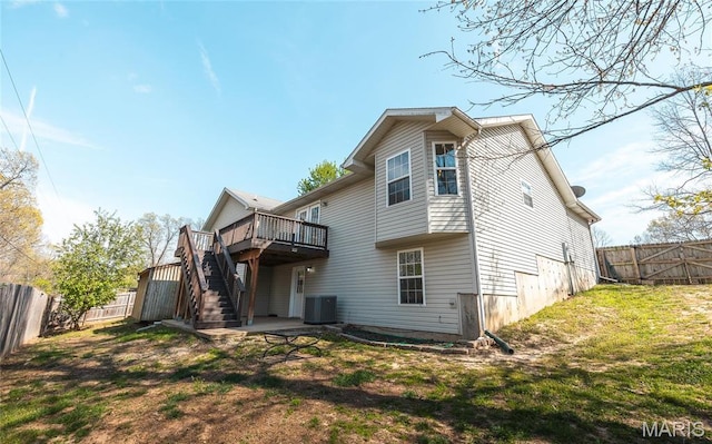 16855 Lemming Ln, Saint Robert, MO 65584 - back of property featuring a wooden deck, stairway, and central AC