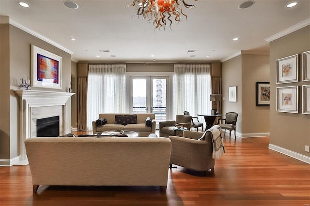 155 Carondelet Plz Unit 600, Saint Louis, MO 63105 - living area featuring baseboards, crown molding, wood finished floors, recessed lighting, and a premium fireplace