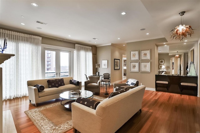 155 Carondelet Plz Unit 600, Saint Louis, MO 63105 - living area featuring ornamental molding, wood finished floors, baseboards, and recessed lighting